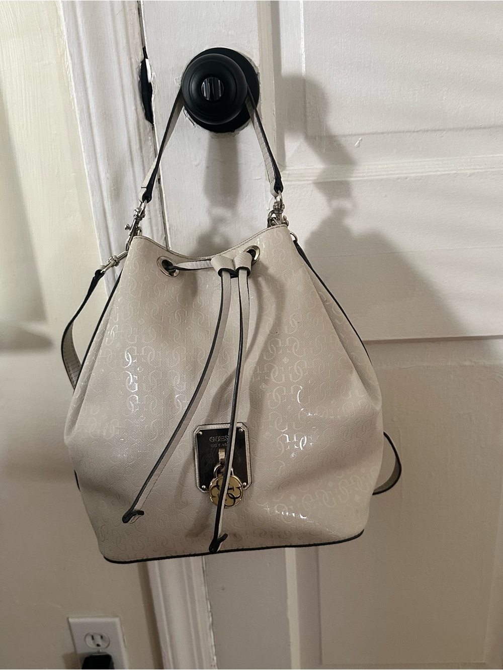 Guess Patent Logo Drawstring Bucket Bag in Cream with Black Trim